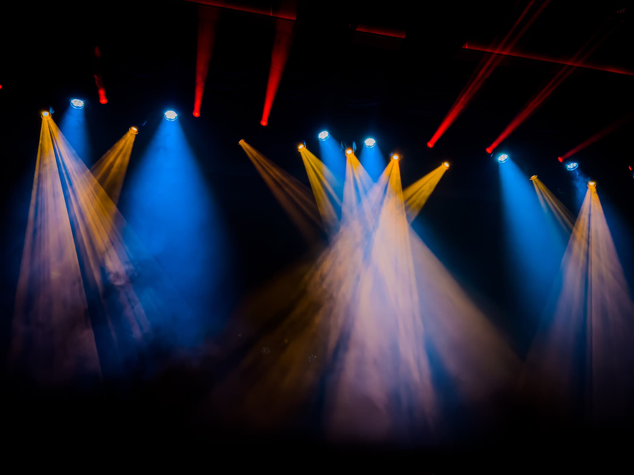 Concert or theater stage lights creating dramatic beams